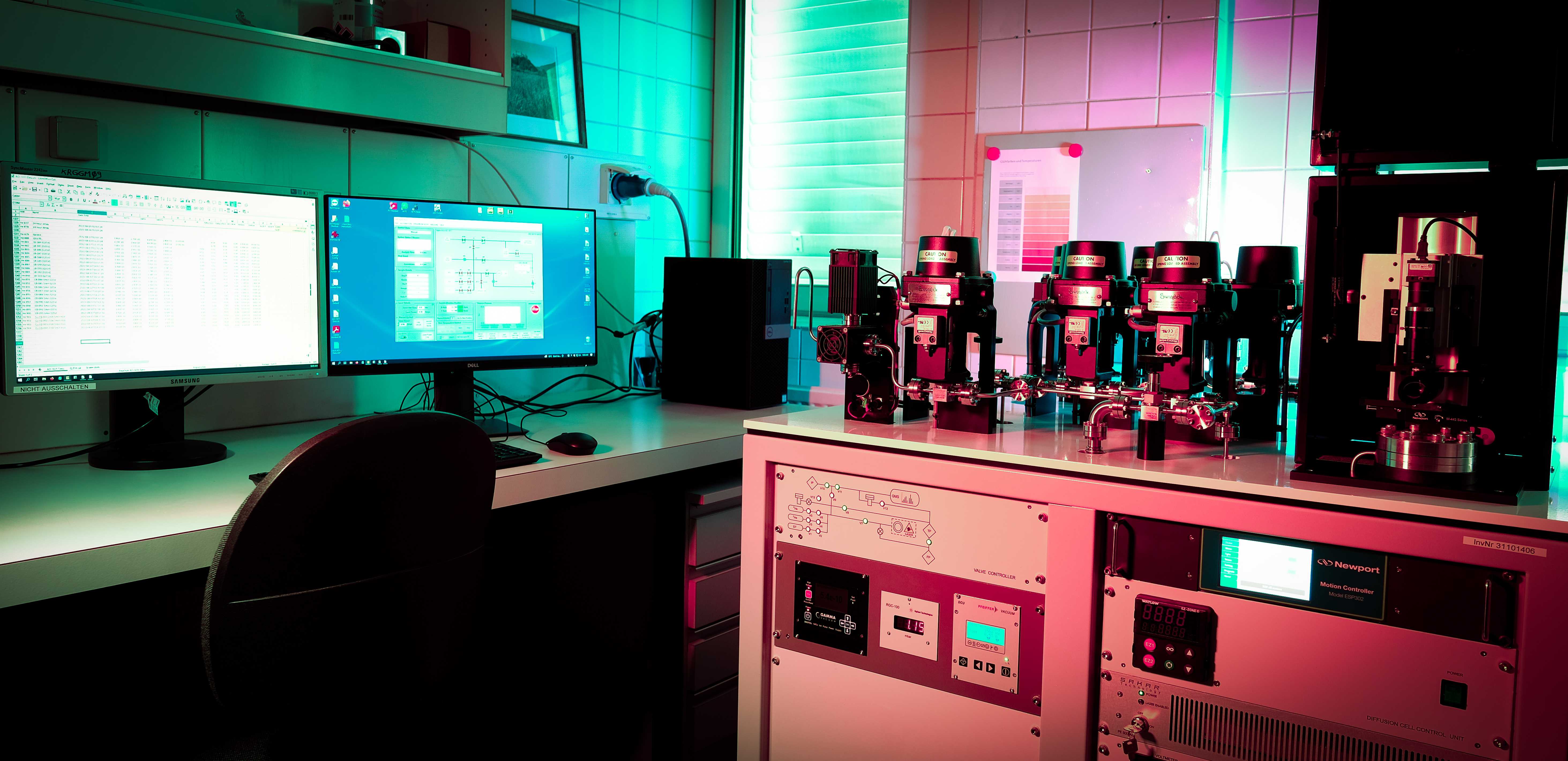 Alphachron laboratory with teal and pink lighting